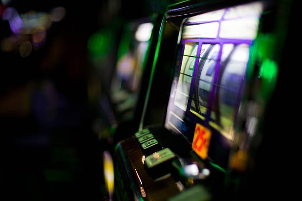 Mobile phone displaying indrabet live casino tables and sports betting interface